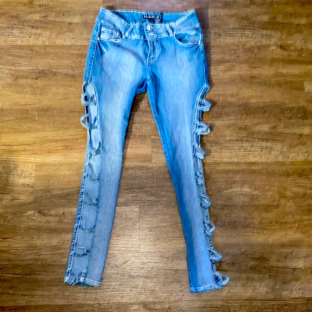 Diamanté jeans with cut out, criss cross sides. Very cute. Size 15